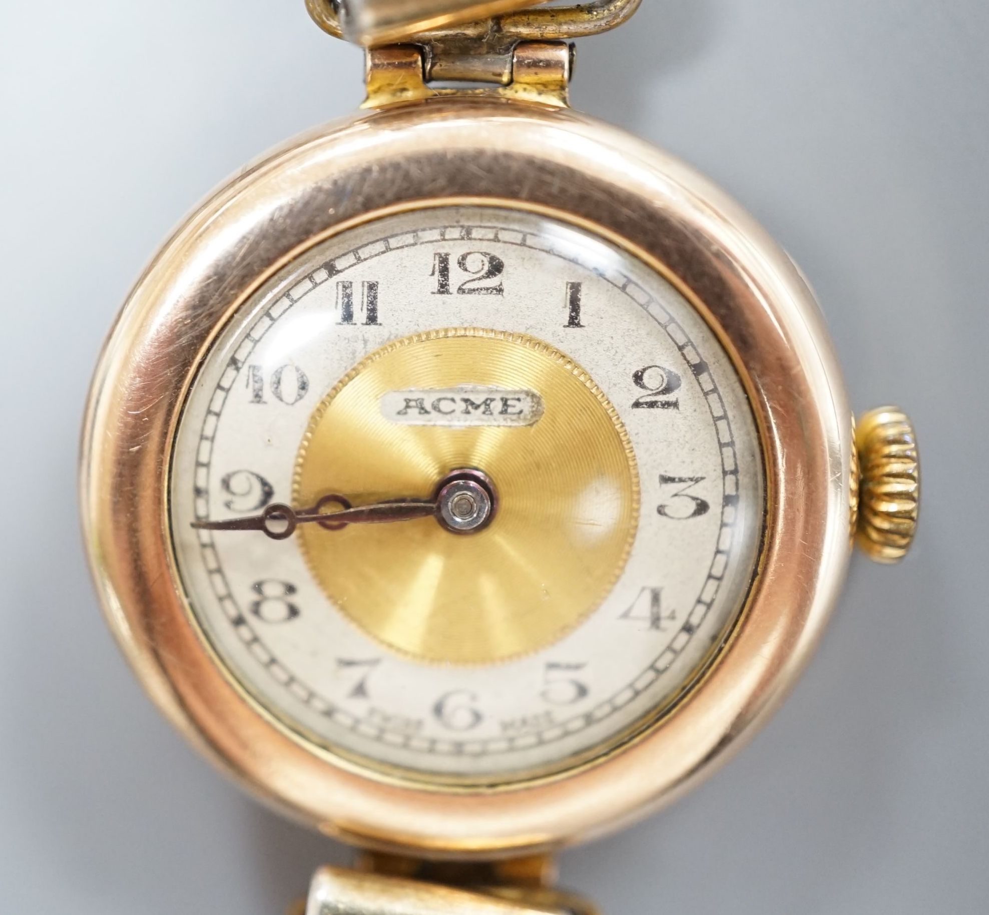 A lady's early 20th century 9ct gold manual wind wrist watch, on a '9ct on Sil' expanding bracelet.